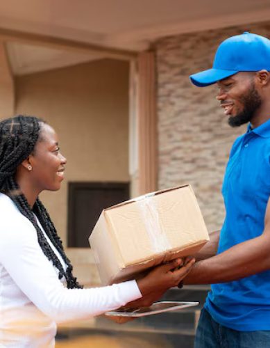 close-up-delivery-person-giving-parcel-client_23-2149095900